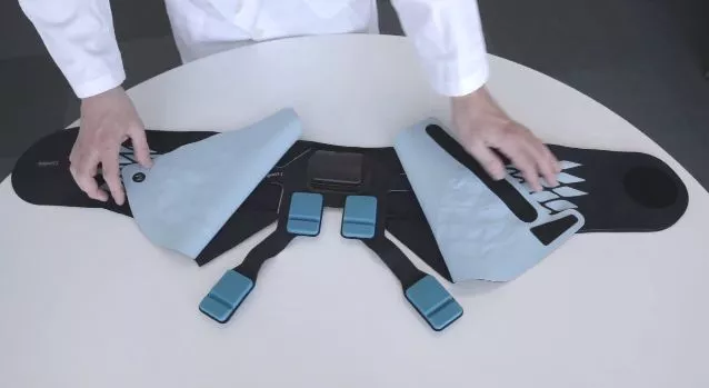 Lumbia looks quite a bit like a conventional back brace, although it contains a series of sensors and activators that make direct contact with key areas of the patient’s lumbar region