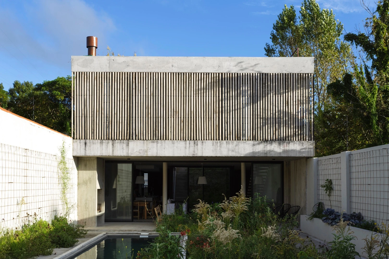 The MeMo House's first floor features large operable wooden shutters
