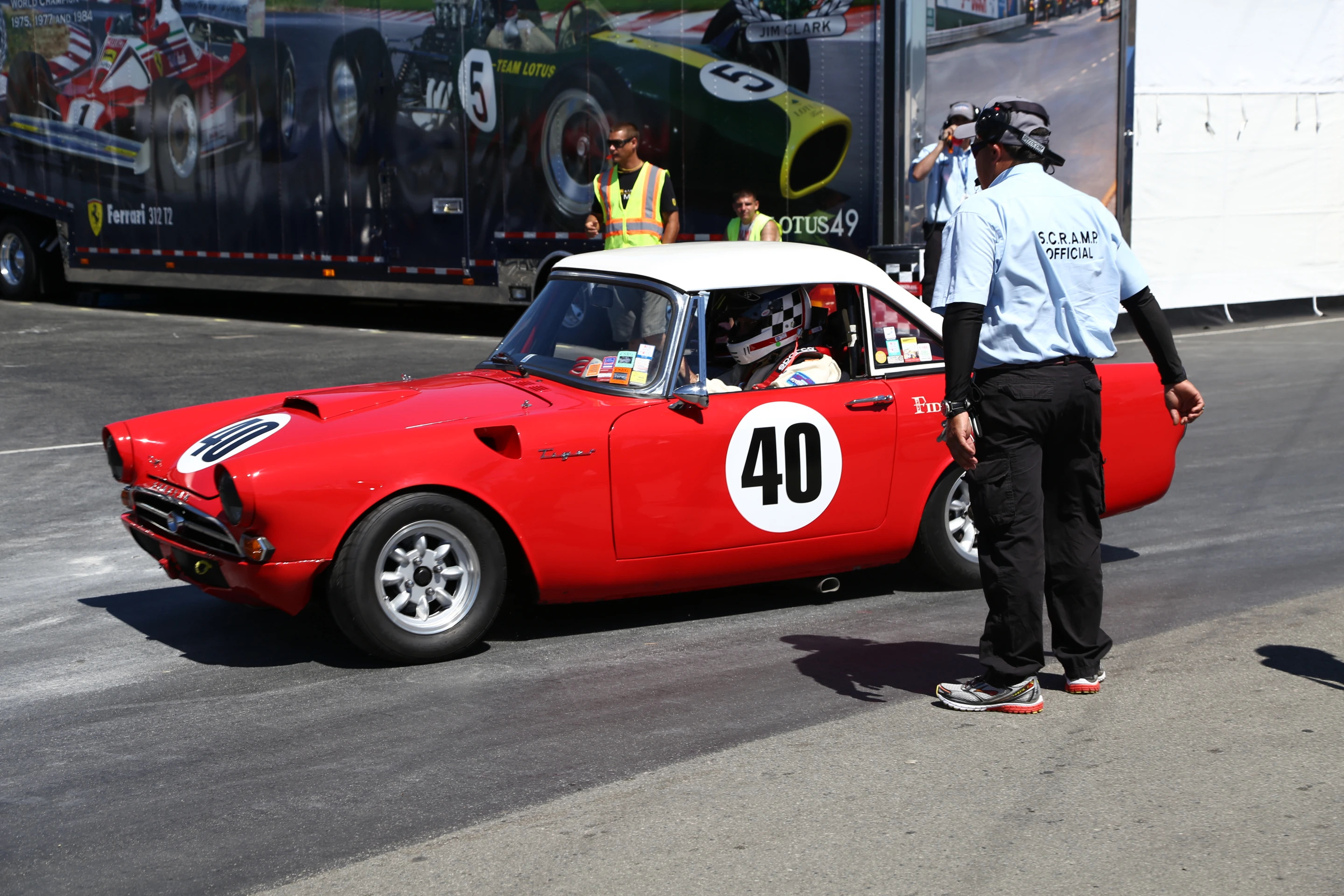 A bright red Sunbeam Tiger on its way to the track at Laguna Seca (Photo: Angus MacKenzie/Gizmag.com)