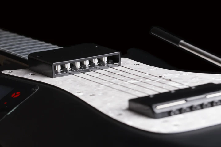 Sensors measure the velocity of each pick and send the information via MIDI