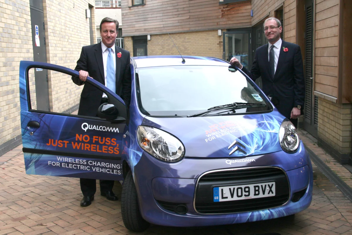 Qualcomm is carrying out a trial in London of its Qualcomm Halo wireless electric vehicle charging technology. U.K. PM, David Cameron (left), supports the initiative