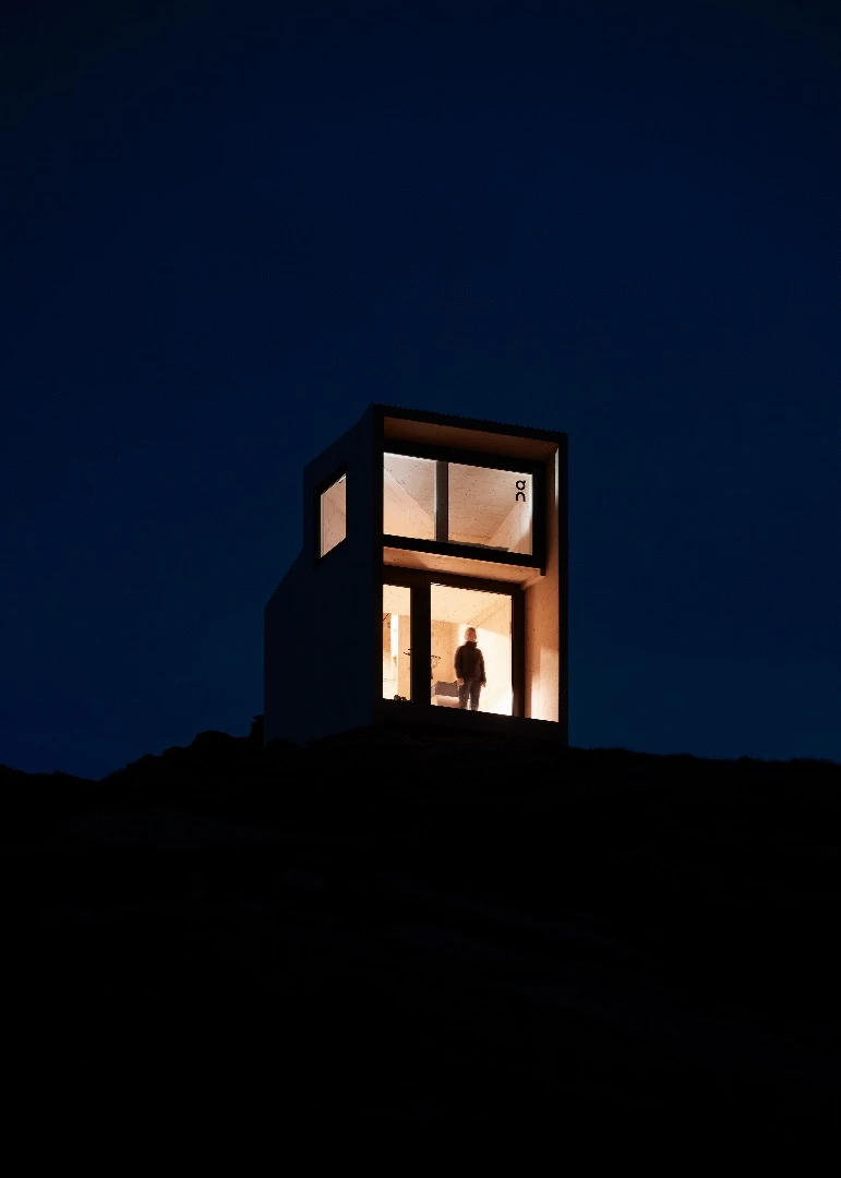 The On Mountain Hut runs off-the-grid, with roof-based solar panels providing power for the interior lighting