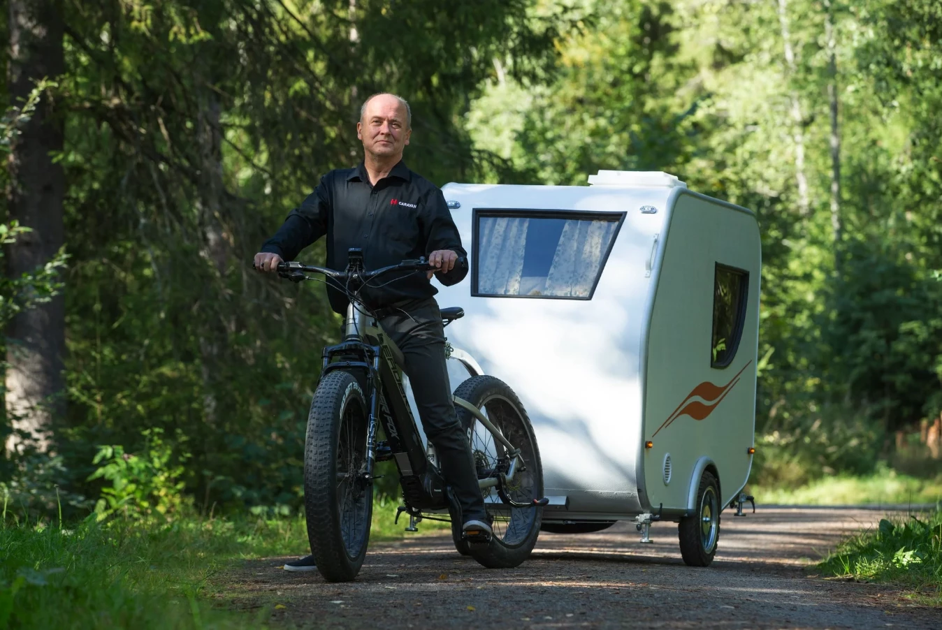 Hupi trailer inventor Urpo "Upi" Merranmaa takes spin with trailer in tow