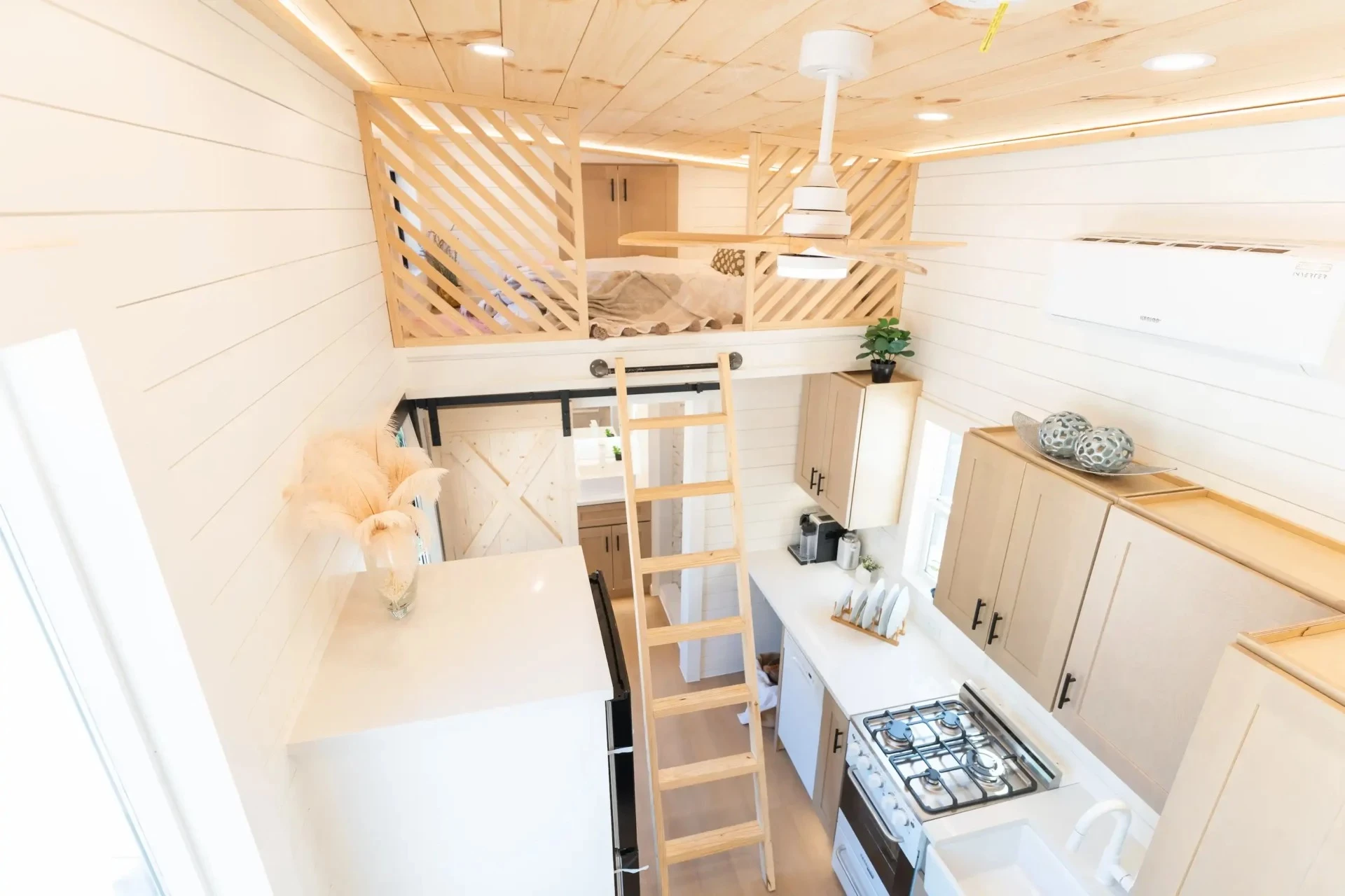 The Premium Vista's secondary bedroom is accessed by a removable wooden ladder