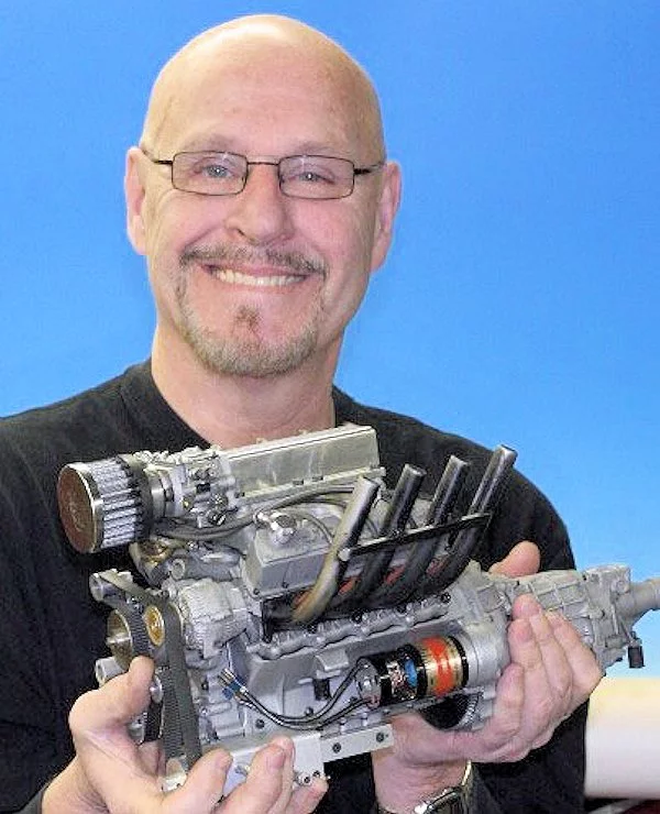 Gary Conley holding a production model of his new supercharged V8 engine (Photo: Conley Precision Engines)