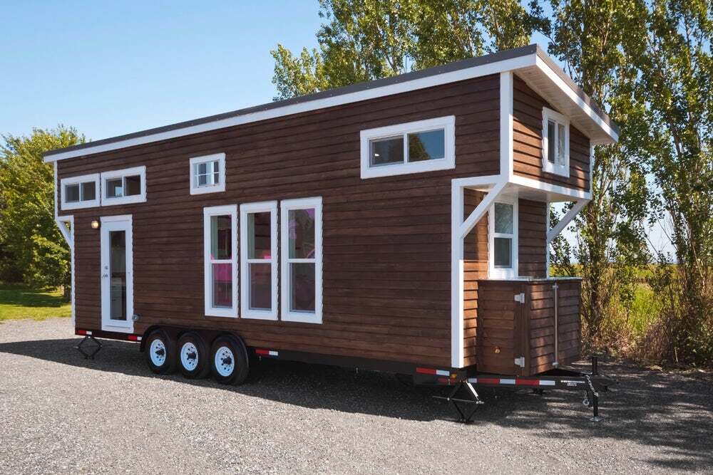 This unnamed steel-framed tiny home features two overhanging loft sleeping areas, bringing its actual length to 32 ft (9.7 m)