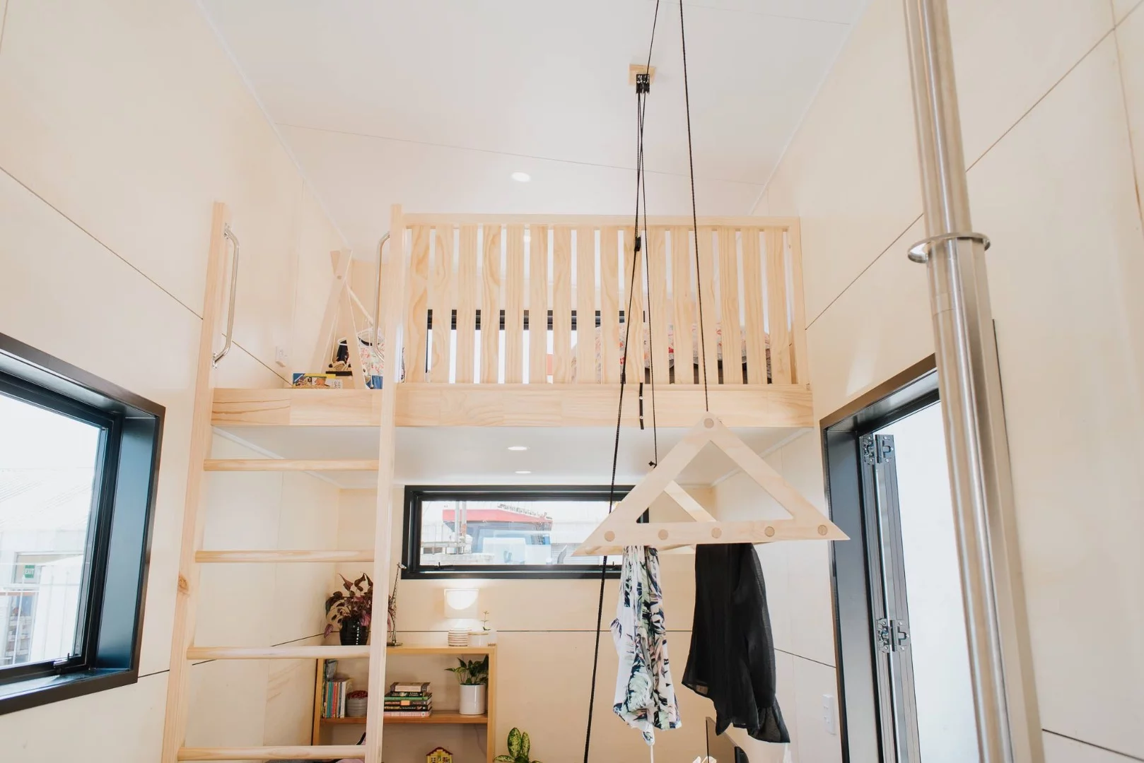 La Sombra Tiny House's secondary loft is accessed by ladder