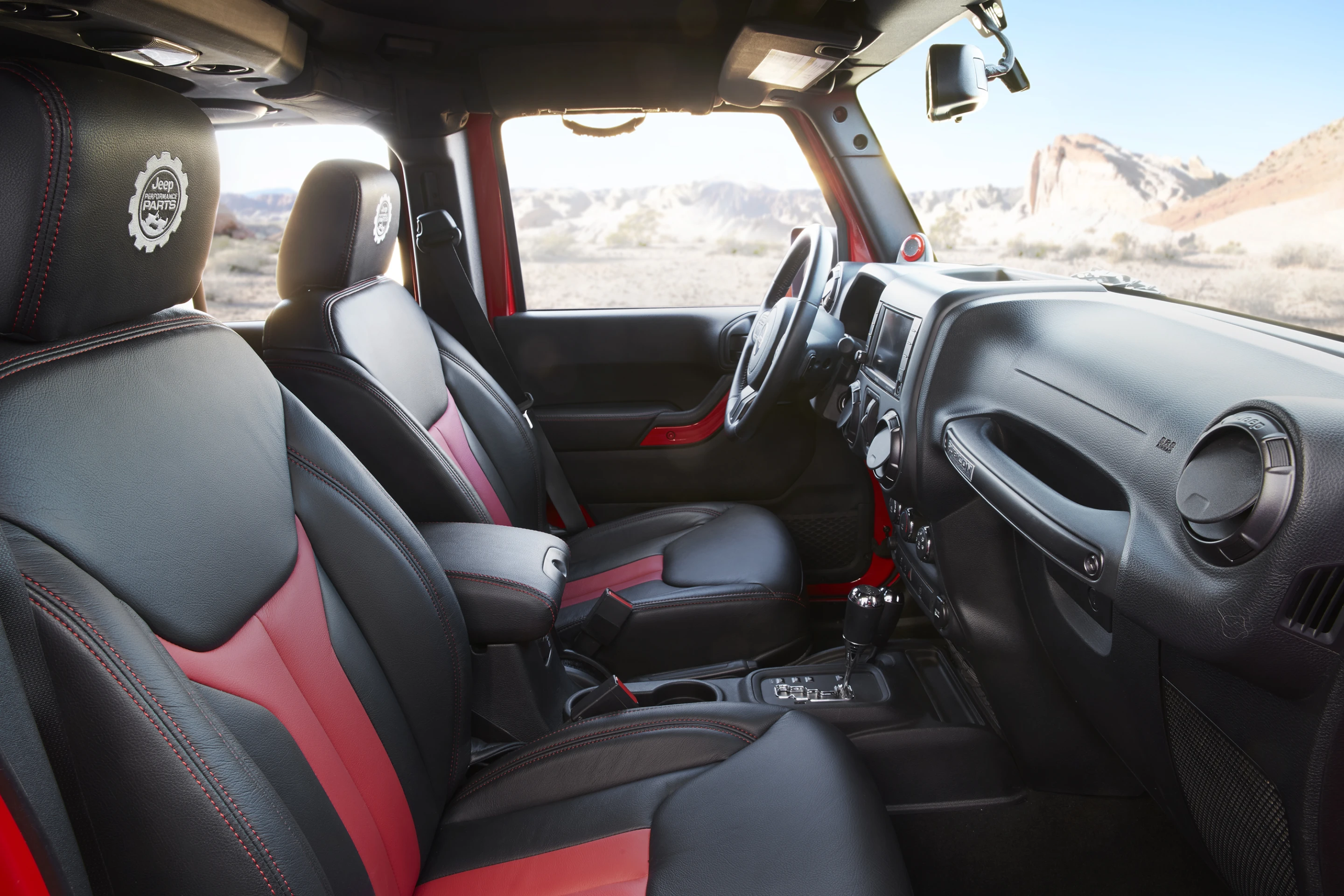 Inside, the Red Rock Responder includes black and red Mopar Katzkin leather seats and the Jeep Performance Parts logo embroidered on the headrests