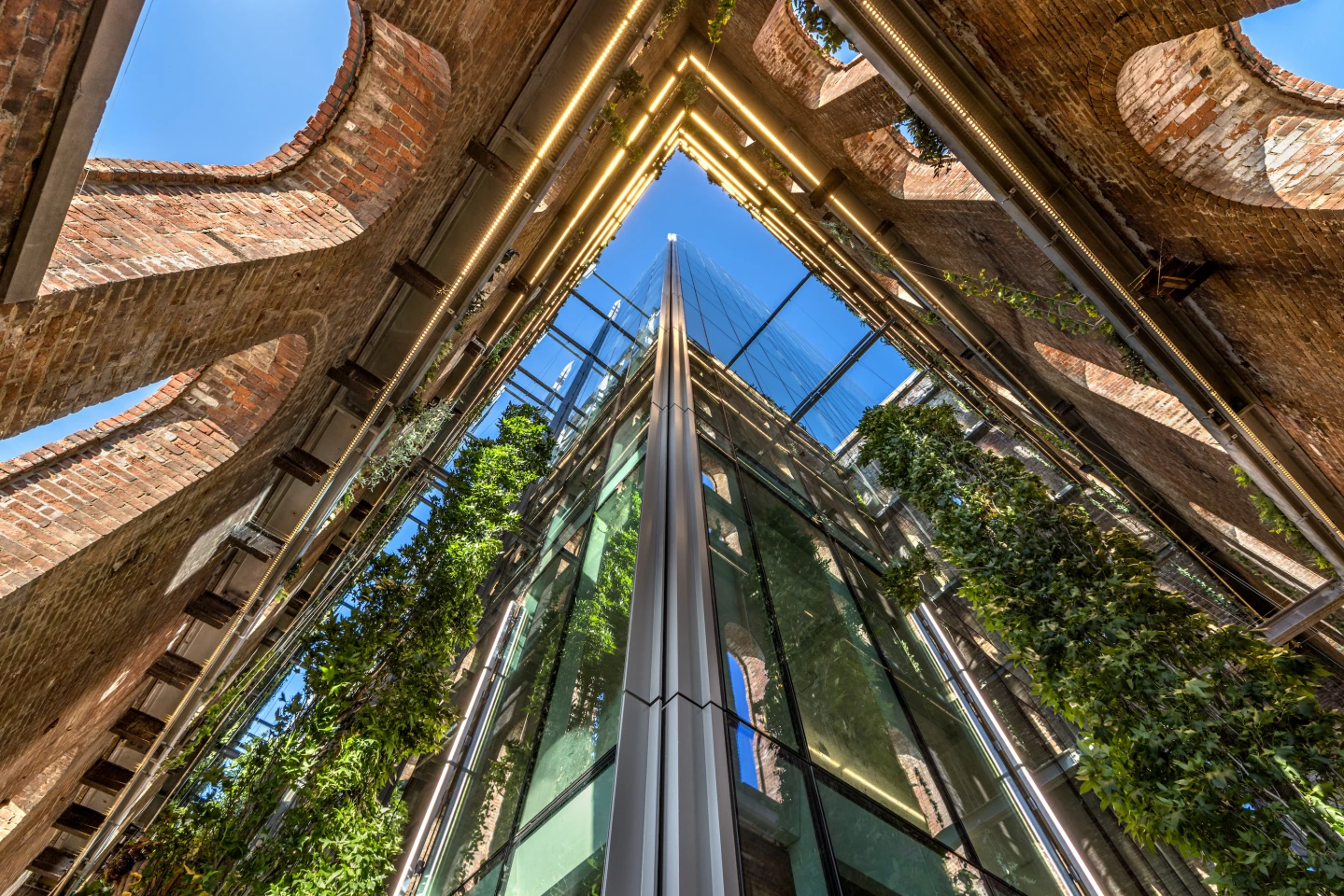 The Refinery at Domino's glazed office building is installed inside the original brick structure