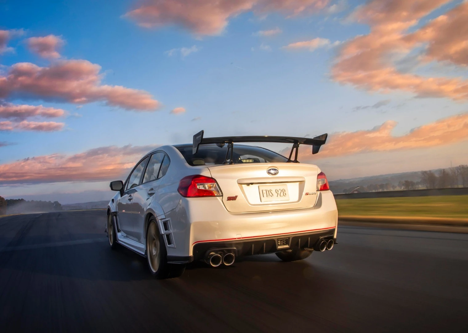The larger wheels allow more aggressive Brembo brakes with cross-drilled steel rotors and 6-piston monoblock calipers (front, 2-piston at rear)