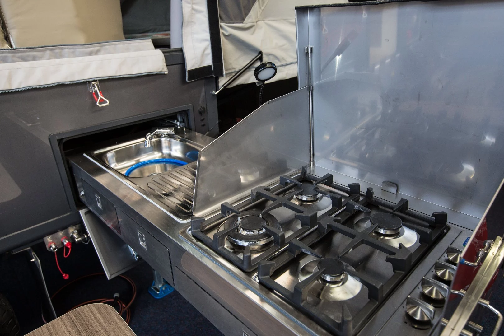 The new Opus Off Road, which is available with either the inflatable Air Opus frame or the hard frame, pulls the kitchen out of the interior and puts it on an exterior slide-out