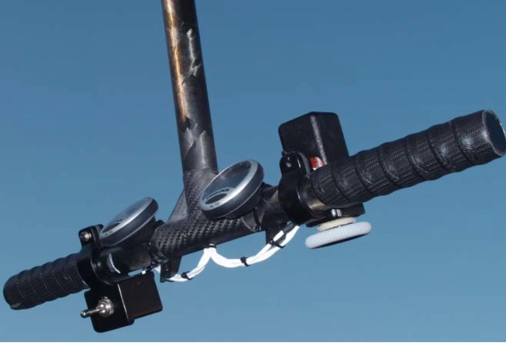 The collective control stick, mounted on a lever arm that is also used to control the weight-shift steering system.