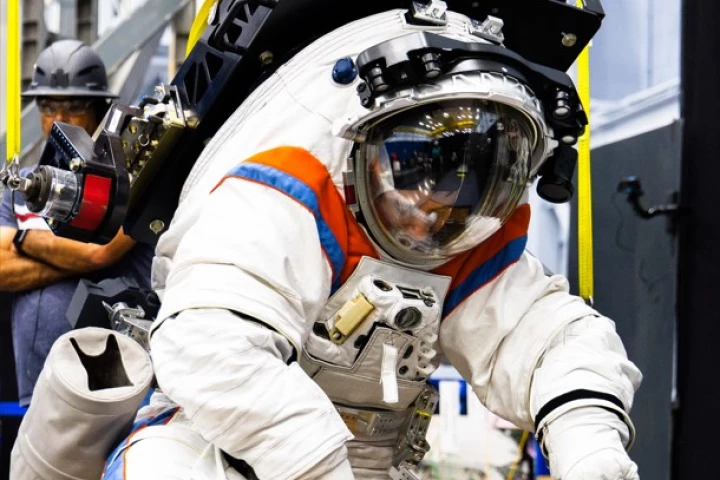 Collecting soil samples in the new space suit