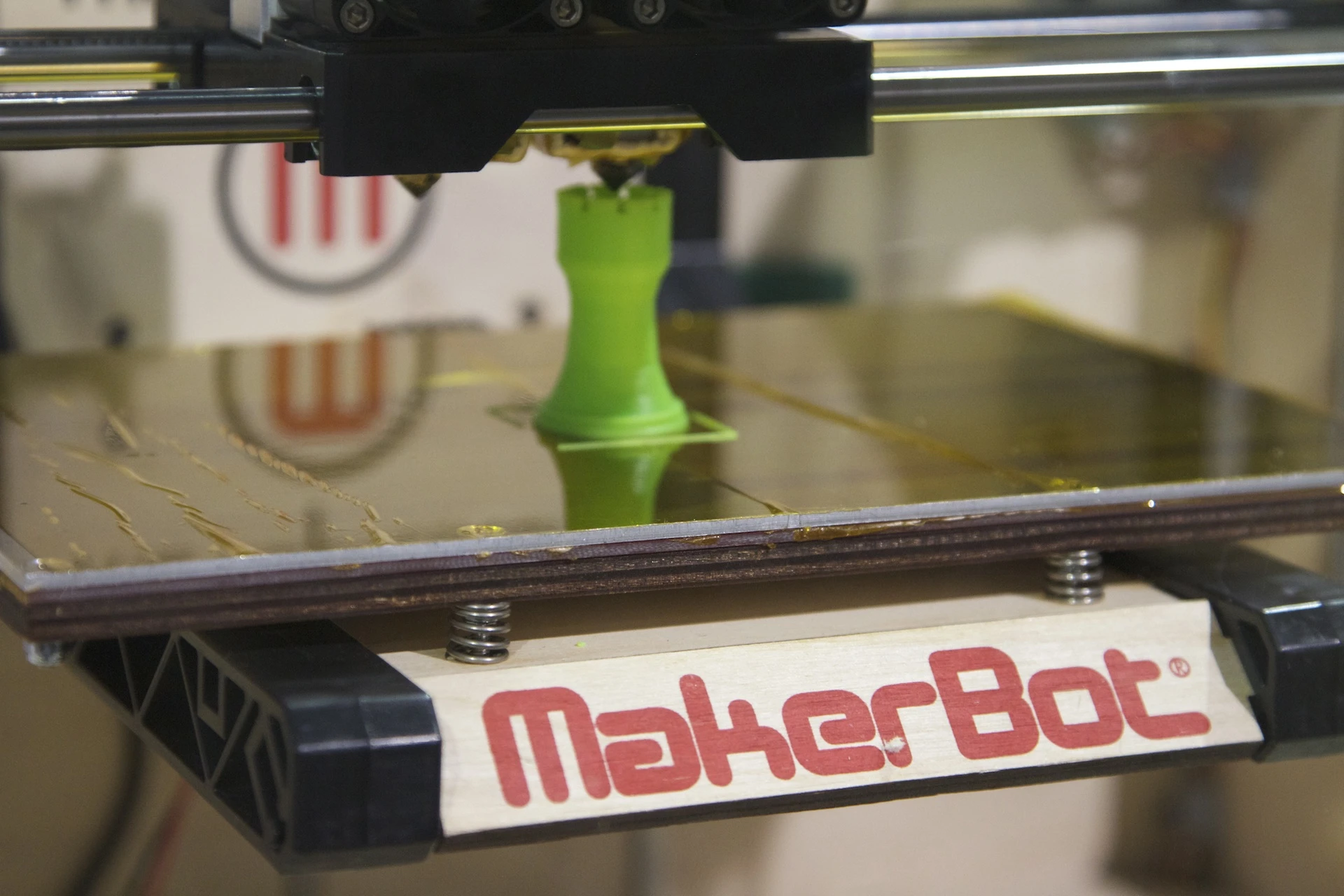 A green Rook being produced by the Replicator 3D printer at CES 2012