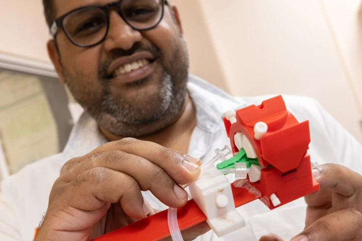 Assoc. Prof. Ashutosh Agarwal with the eye-HOLDER section of the prototype eye-ECMO setup