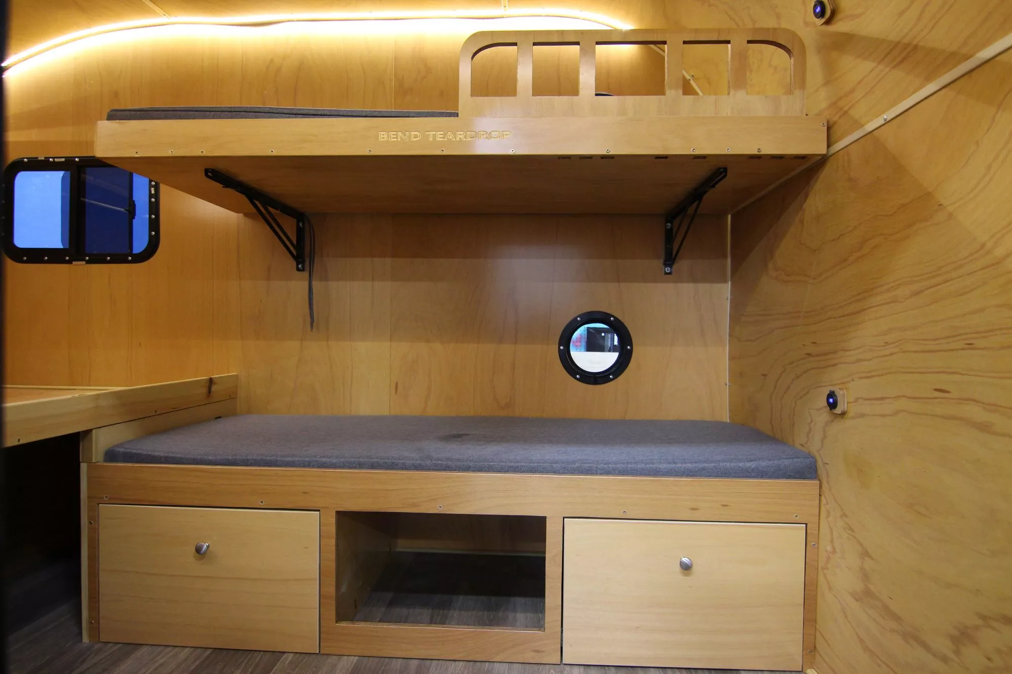 The lower bunk/bench has storage drawers and space below