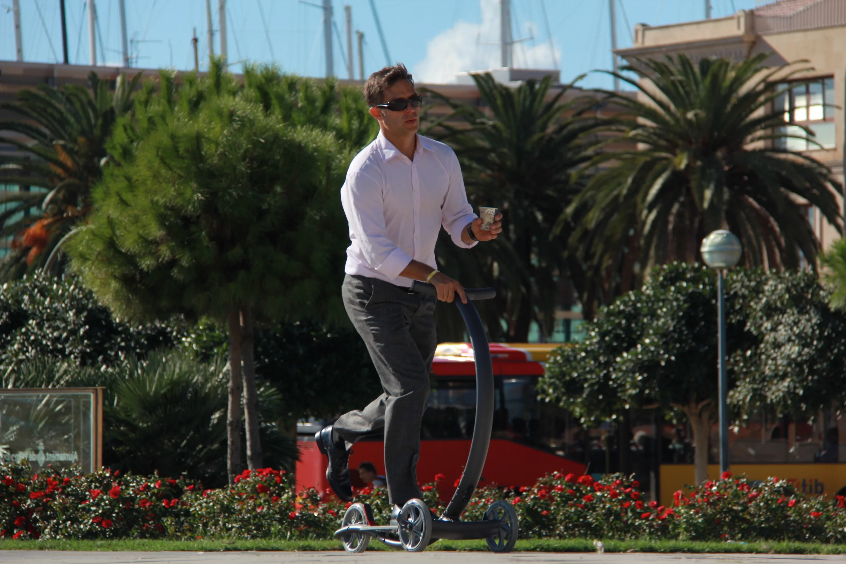 Three wheels and a two-piece, curved aluminum frame