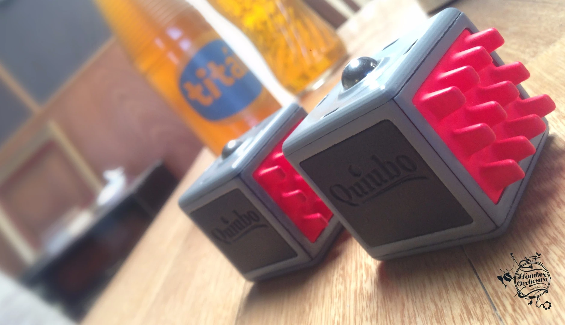 The top face of the Quiubo has a rounded button that users push to distort playback in combination with tilting or twisting action