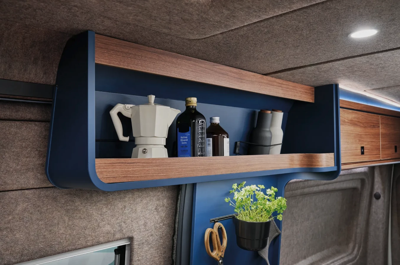 Above-galley shelf