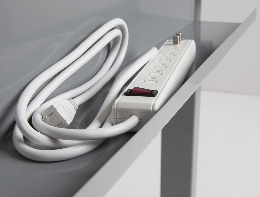 An optional extra on the StandDesk is a cable management tray for storing a surge protector