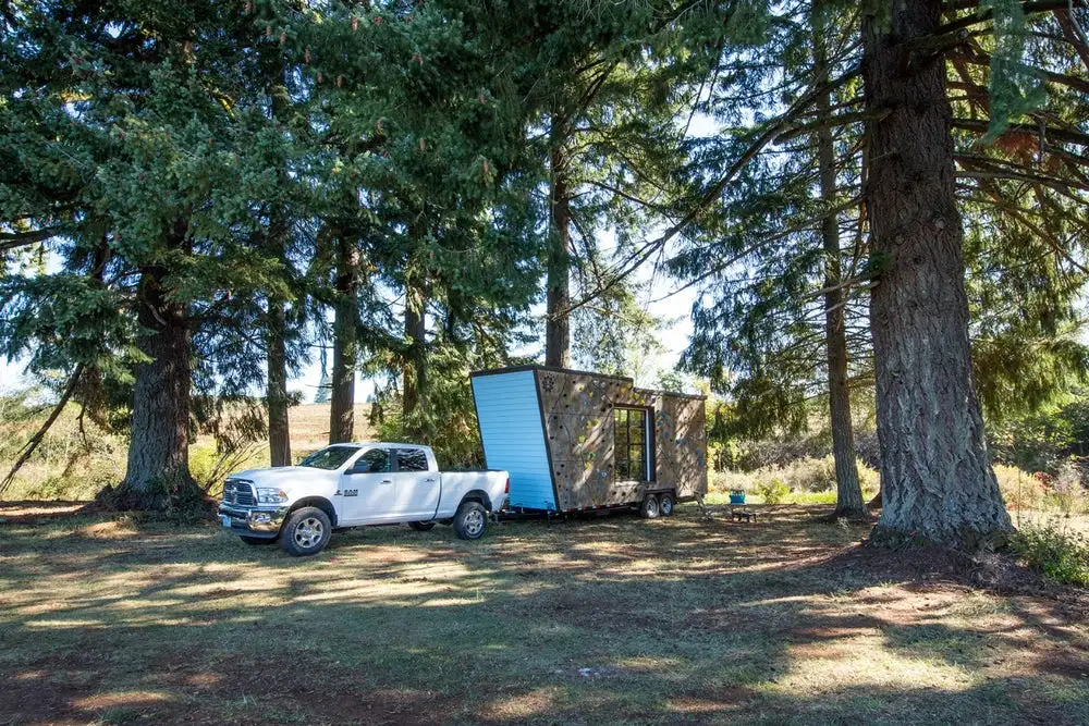 The Tiny Adventure Home is based on a double-axle 28 ft (8 m)-long trailer