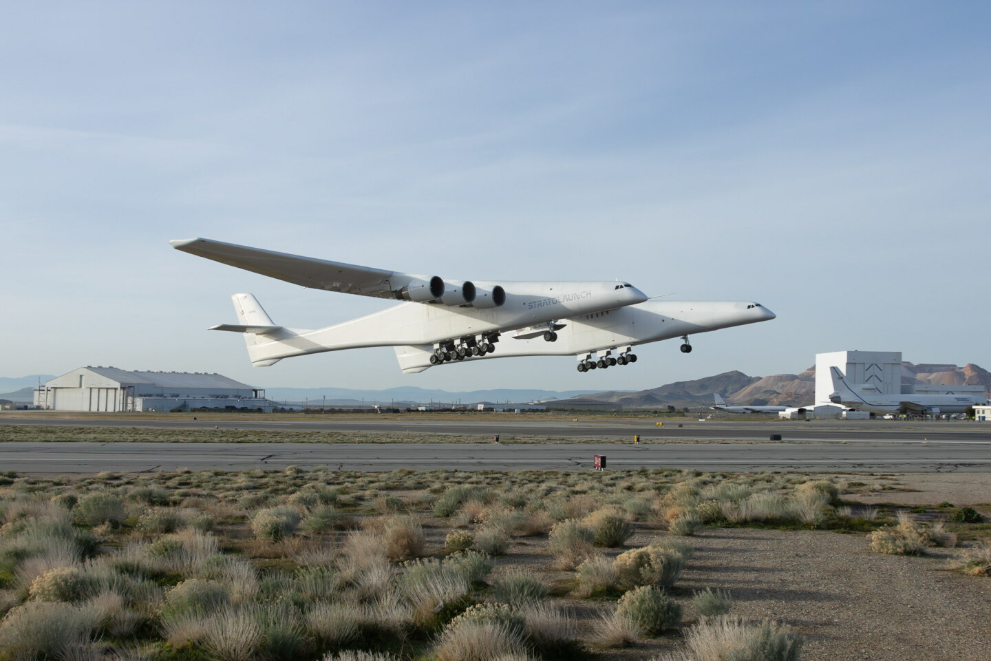 The Roc takes off from the Mojave Air and Space Port with the much smaller TA-1 slung underneath