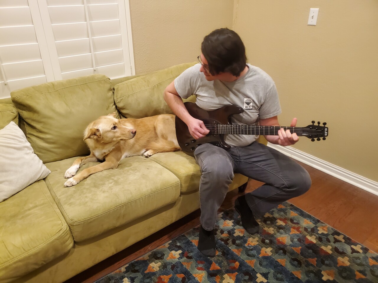 The carbon fiber neck is topped by a synthetic ebony fretboard
