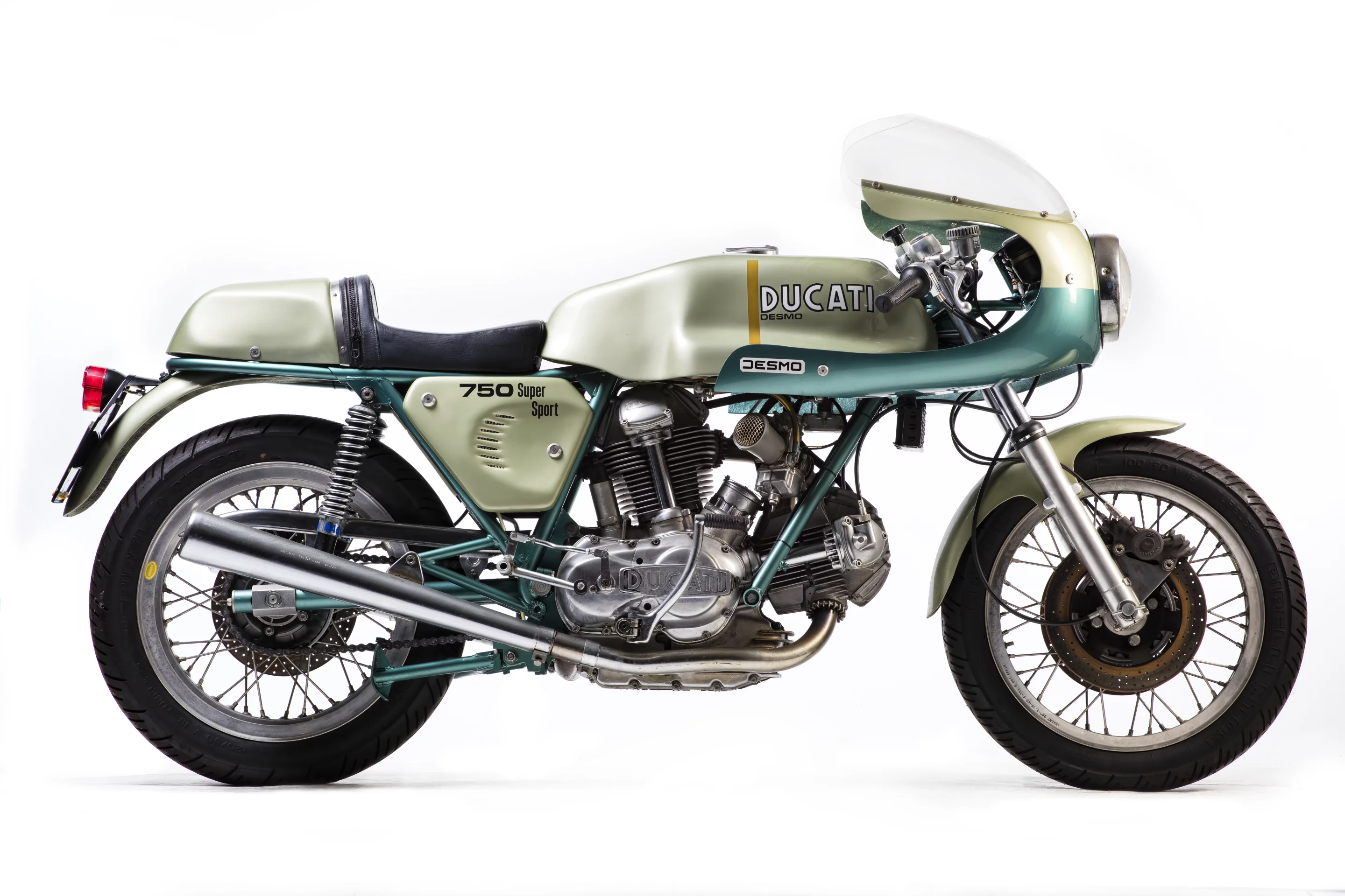 Slightly compromised in that it is not a matching numbers bike, the bike is regardless one of the original 401 examples of the green-framed 72 hp Desmo 750 SS which was produced to celebrate the Ducati 1-2 victory of Paul Smart and Bruno Spaggiari in the 1972 Imola 200 Mile race. That non-matching engine number cut $100,000 from the price, as a new world record for the 750 SS was achieved just a month ago when Gooding & Company sold a near identical 1974 Ducati 750 Supersport for $176,000, beating out the previous record of $152,885 (sold for €114,371) set at the Paris Retromobile auctions in February, 2013 by Artcurial. The bike (Lot 574) sold for £52,900 ($68,923).