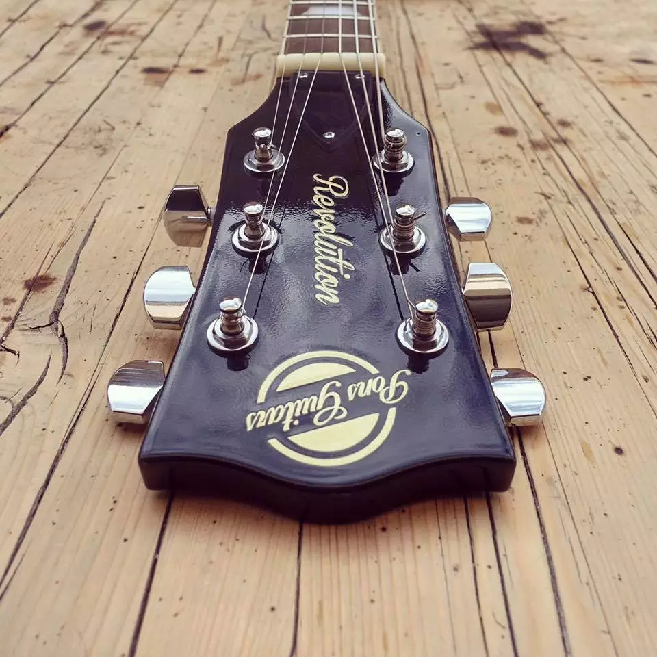 The Revolution's Pol body core has a maple neck ending in a Les Paul-like headstock