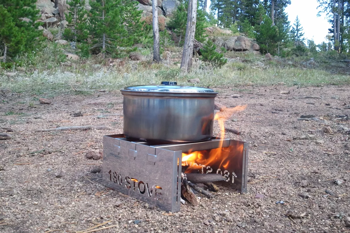The 180 Stove vents and protects your fire so that it's focused on the pot above