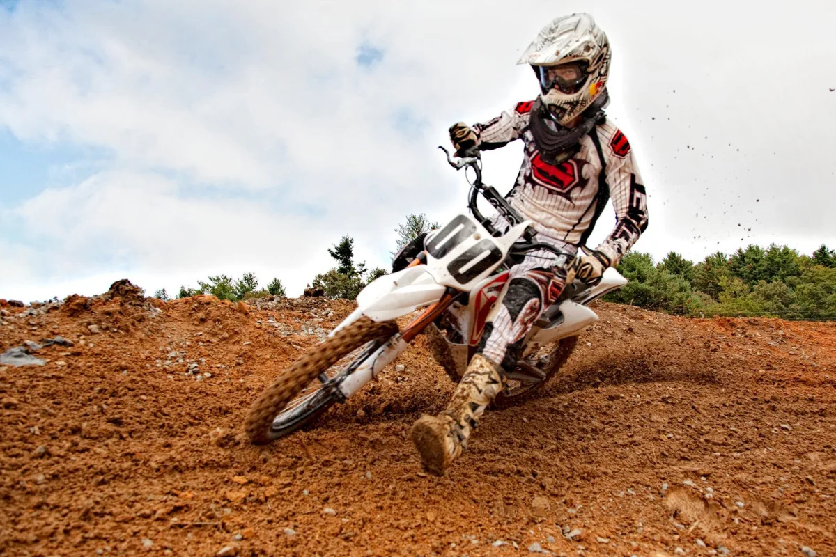 Cornering and kicking up dust on a Zero MX electric bike at the Dark Green track in Penrose, North Carolina
