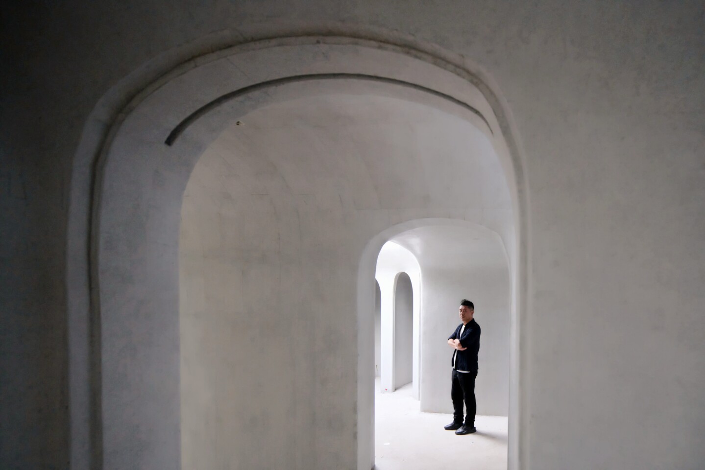 The Wormhole Library's curved concrete walls are being cast using both a CNC router and a 3D printer