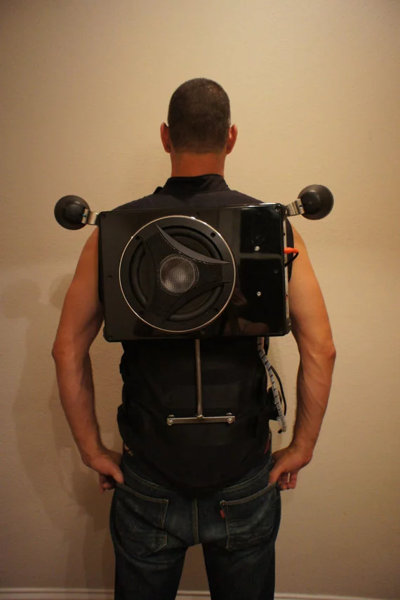 The Party Vest comes retrofitted with an 8-inch Boss audio bass 900 subwoofer, with a pair of motorcycle speakers reaching over each shoulder