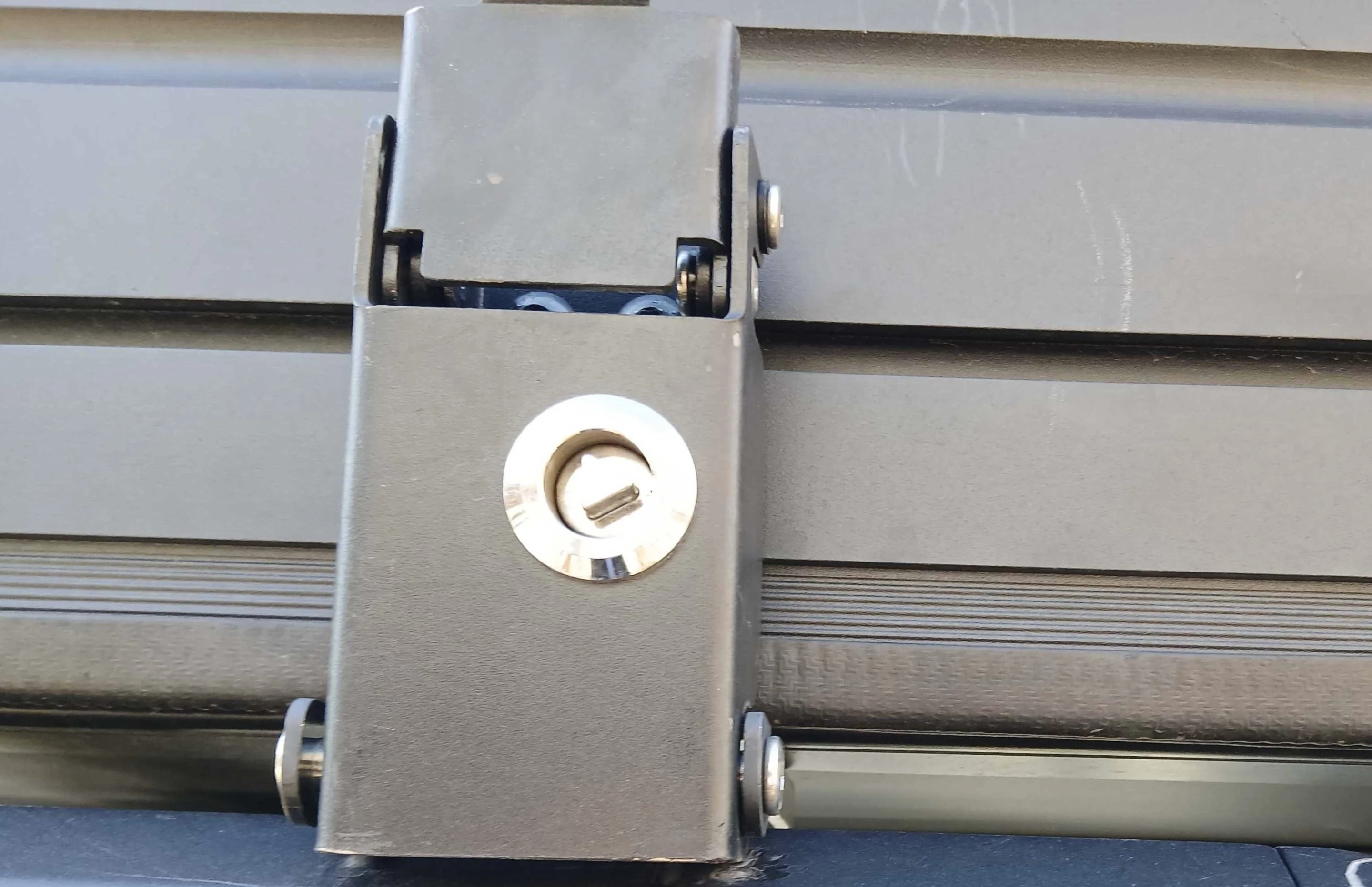 The Vision XL latch closed over the on the tent base, its round triangular-core lock just taunting me