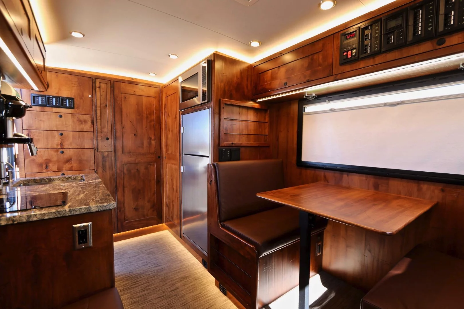 EarthRoamer XV-LTS interior with distressed knotty alder wood and brown upholstery