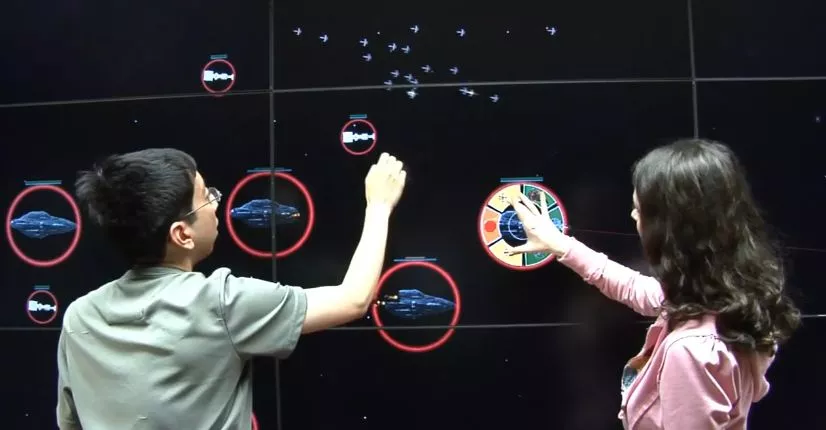 A graduate student has developed an RTS game played on a 20-foot wide LCD multi-touch wall (Image: University of Illinois)