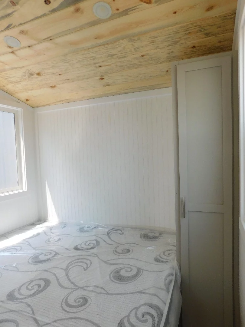 The Ozark's snug bedroom includes integrated storage