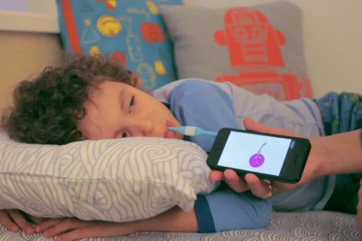 The Kinsa Smart Thermometer in use