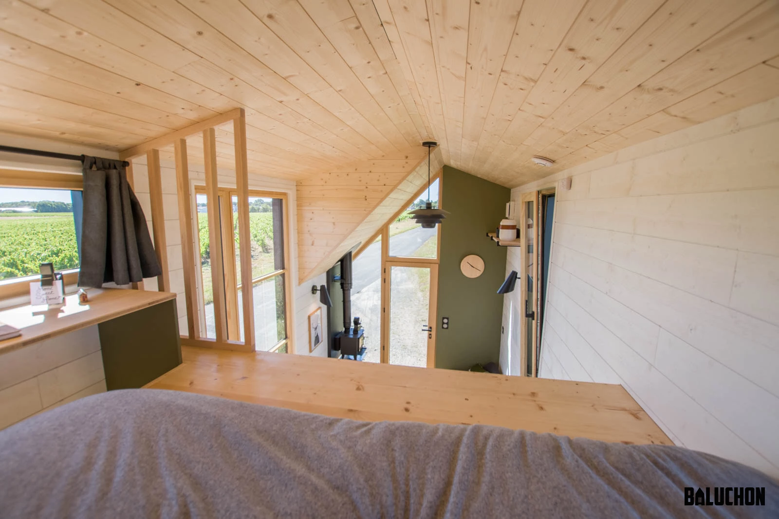 The Tiny House Sauvage's interior looks light-filled and airy thanks to its high ceiling and generous glazing