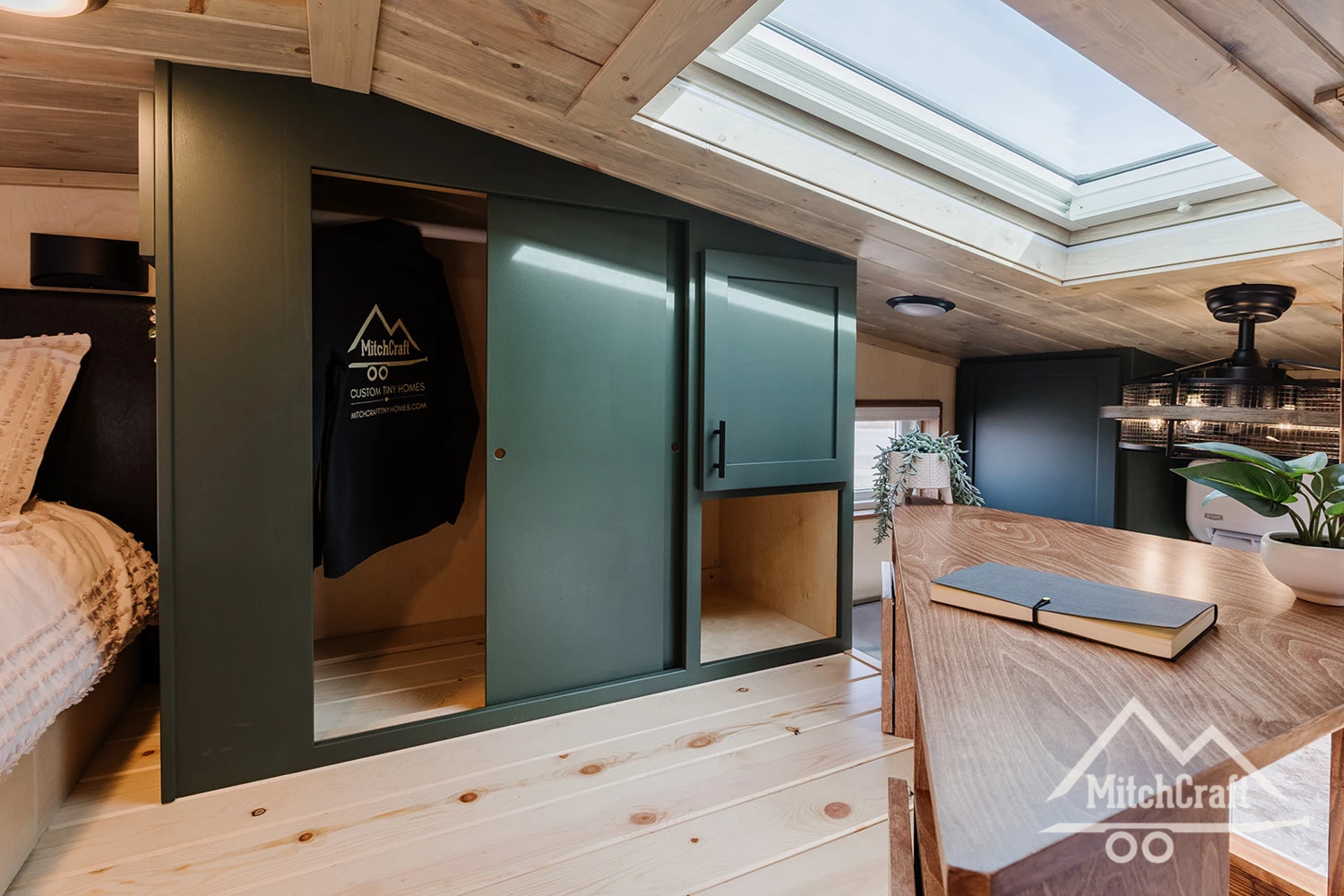 The bedroom in Nicole's 16 x 8 Tiny Home is topped by a skylight