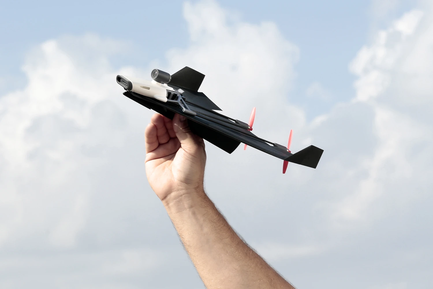 The PowerUp FPV consists of a front-located electronics module, a nylon/carbon fiber frame, and two props in the rear, all of which are attached to the top surface of a user-folded paper plane