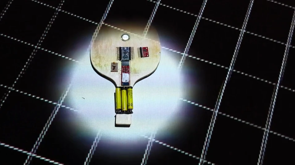 Pingtime augments an ordinary table tennis table with projections and sounds by equipping the paddles with sensors and using an infrared camera to track the ball (Video still: videogram)