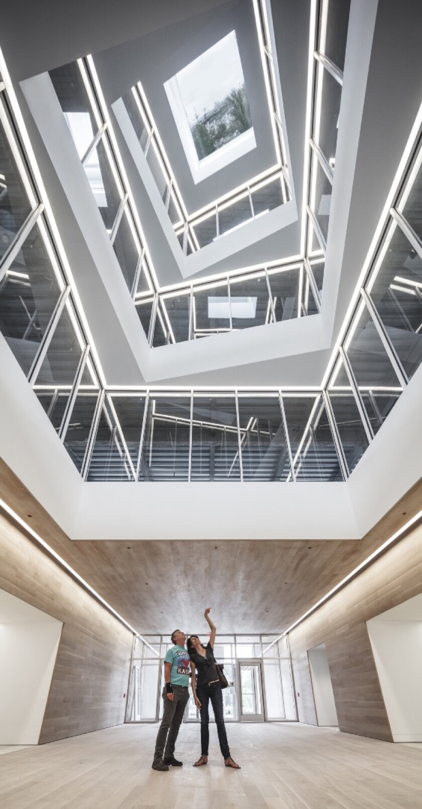 By inserting angled mirrors on the roof, BIG has made it so that people can simply look upwards and enjoy a rooftop view of the docks