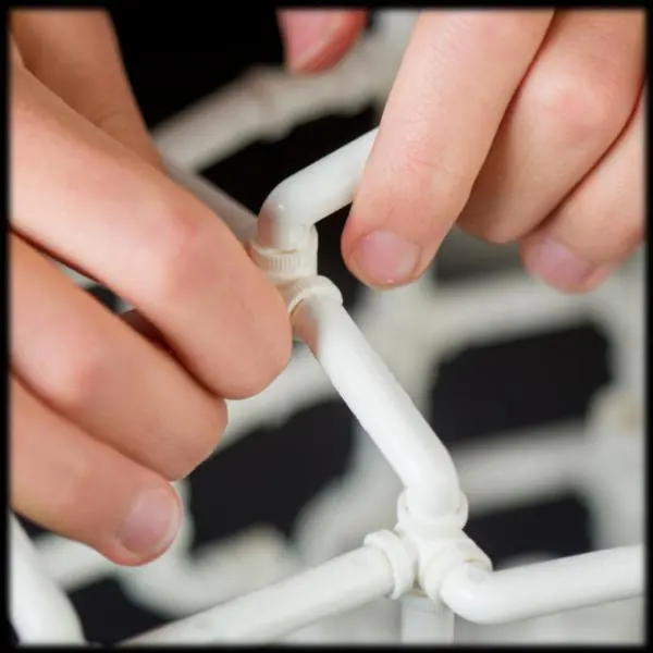 A close-up of someone building with Crossbeams