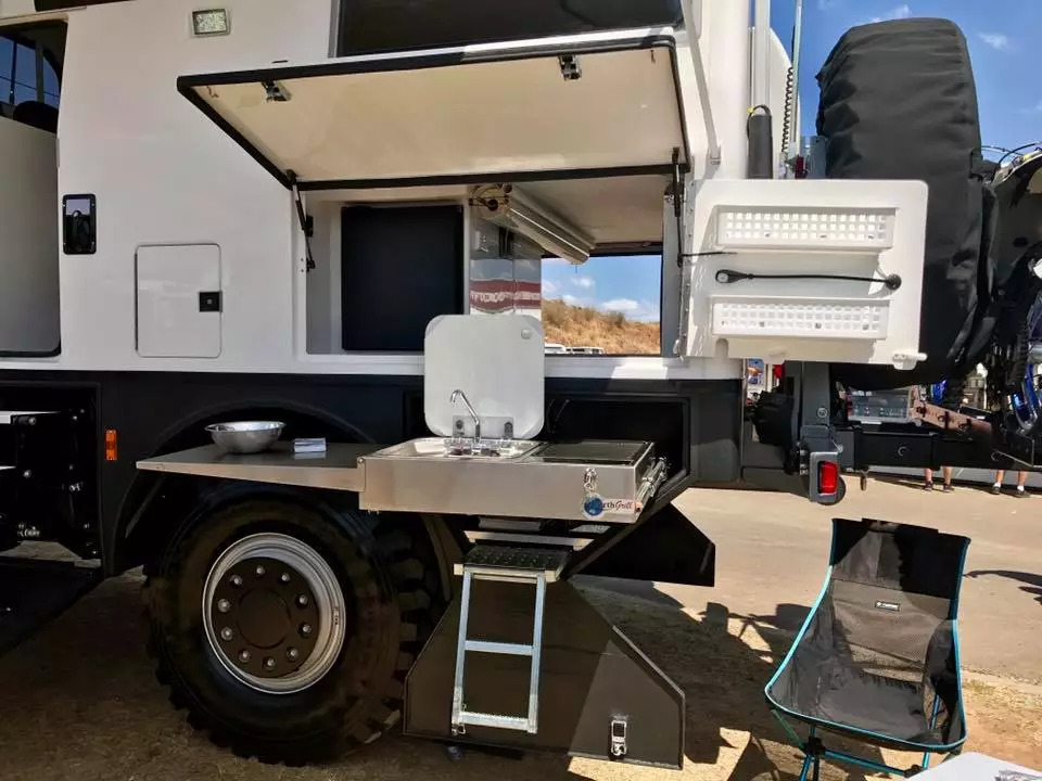 The pull-out outdoor cooking area includes an electric grill