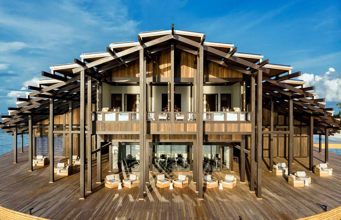 The wooden structure of the island retreat, including each residence, is built with eco-conscious materials