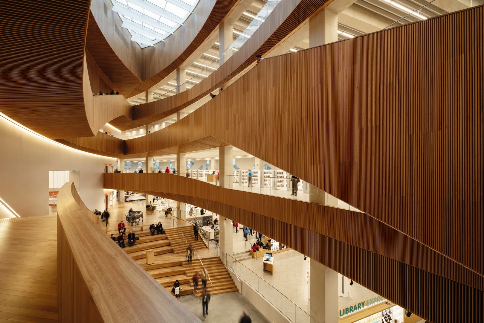 Calgary Central Library's main atrium is defined by its double-curved shell created from planks of western red cedar sourced from British Columbia