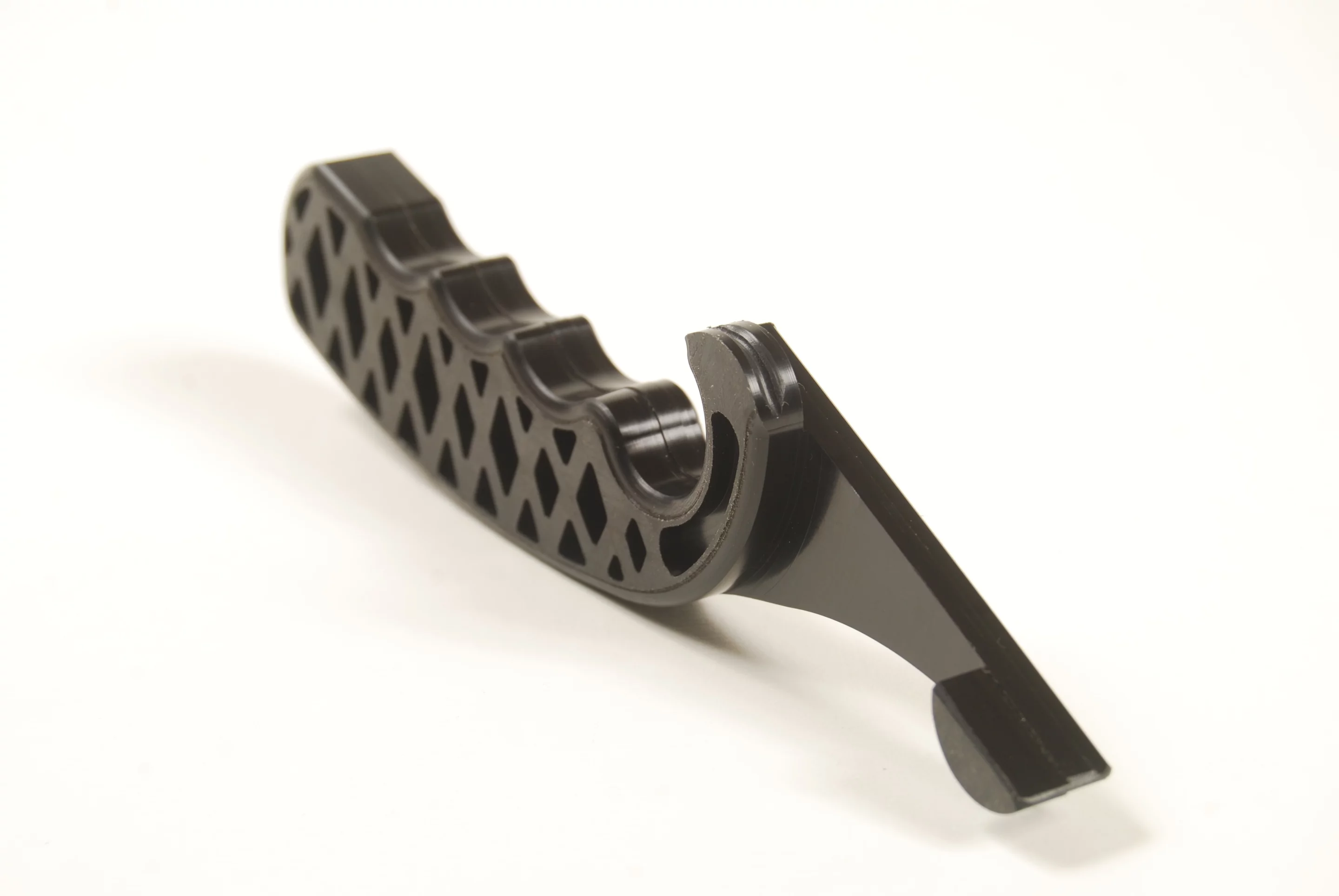 String Stretcha is made from a crush-resistant epoxy material and features a hook and heel that grips the string while the player/tech runs the tool up towards the nut and back again