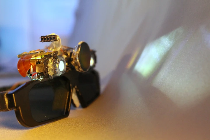 In the CastAR system, glasses project light onto a retro-reflective screen to create a 3D augmented reality experience