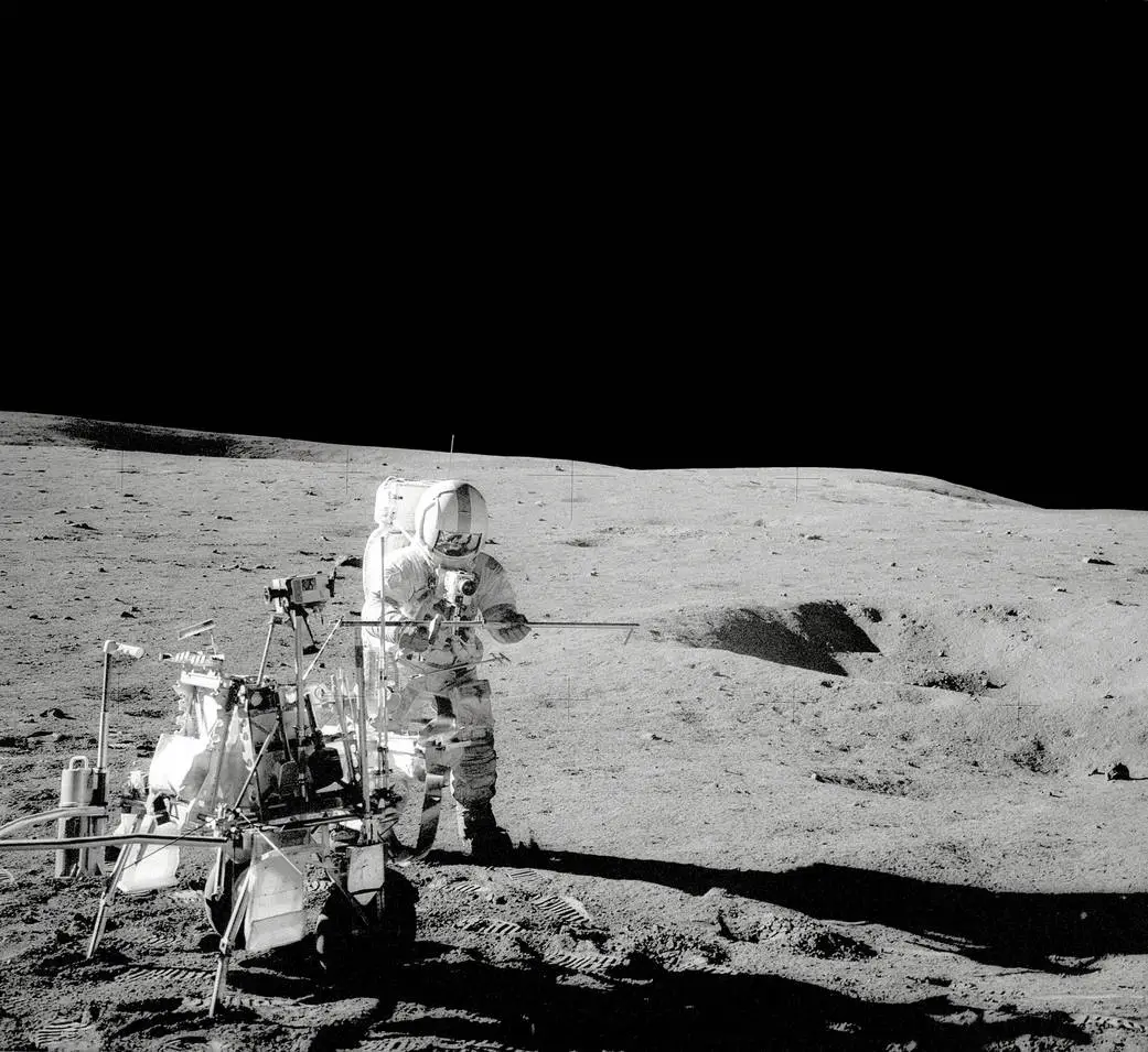 Apollo 14 crew members walk the moon on February 5, 1971